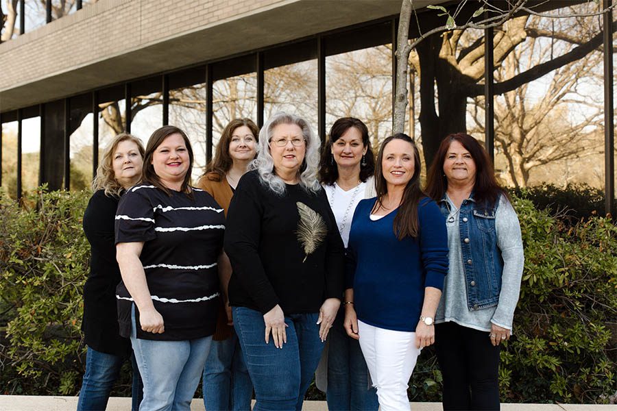 About Our Agency - Boyle Insurance Agency Female Team Members Standing Outside in Front of the Office As They Smiling and Pose Together for a Photo on a Nice Day